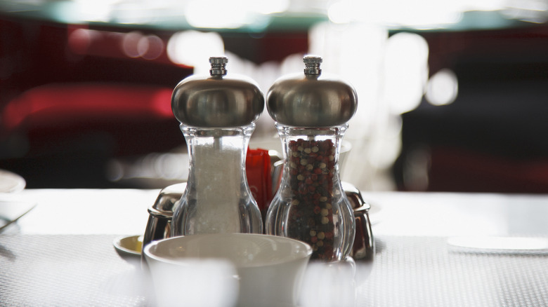 salt and pepper shakers on restaurant table