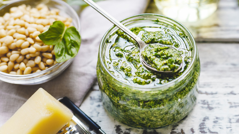 jar of pesto with pine nuts and parmesan cheese